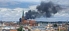 Blick auf Schwerin mit Rauchwolke
